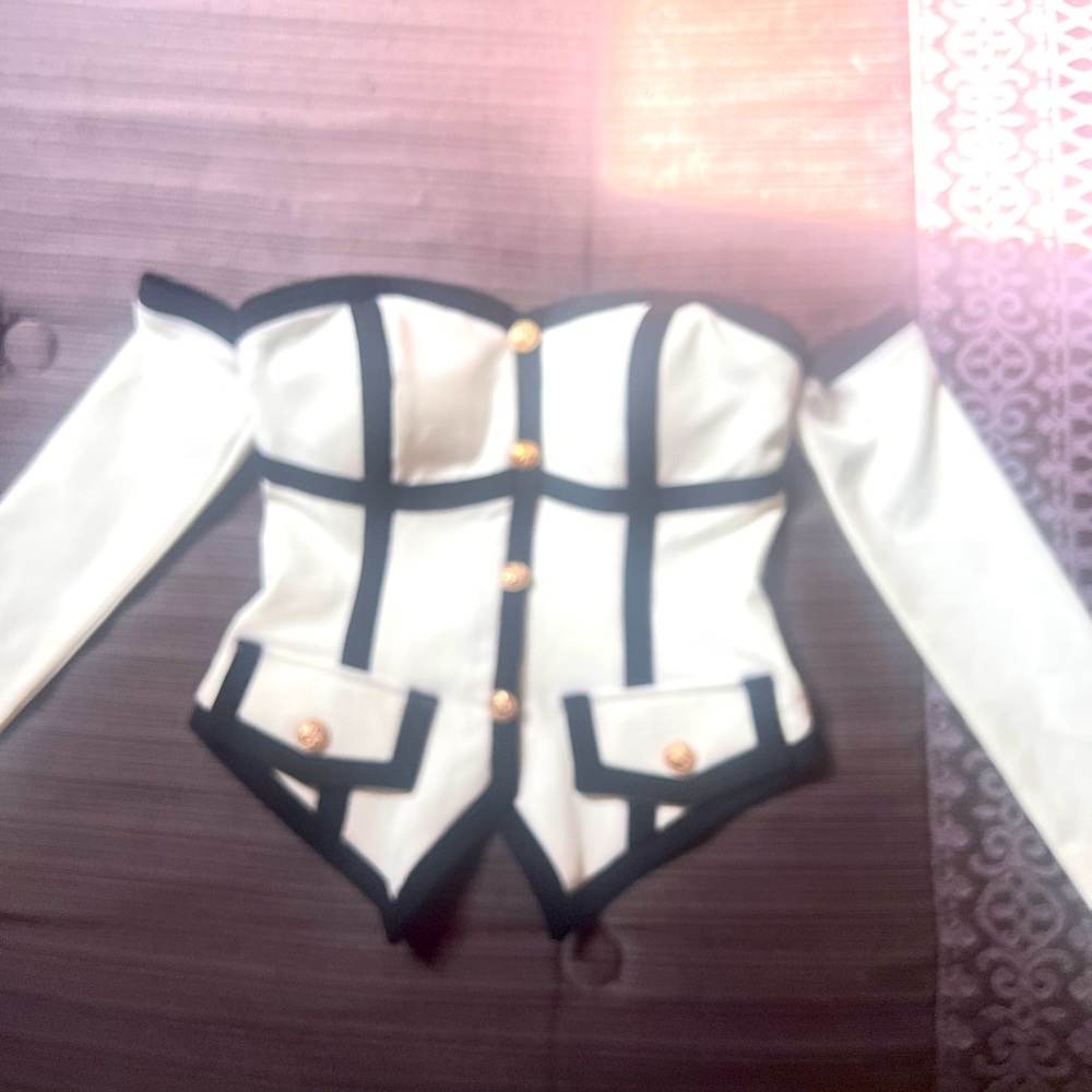 From the store HONEY this is a beautiful piece goes with slacks or skirts